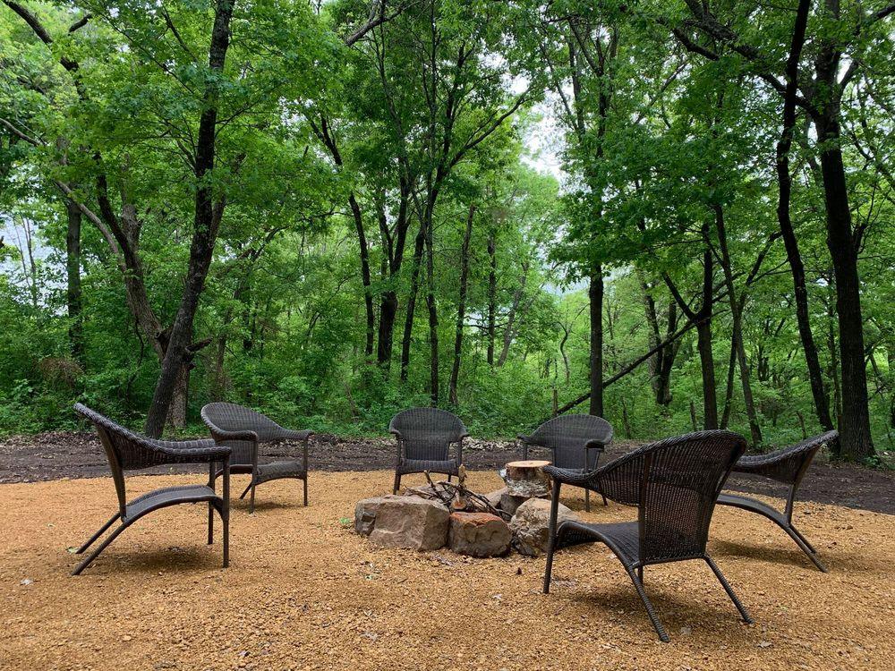 Firepit circle with chairs in the woods