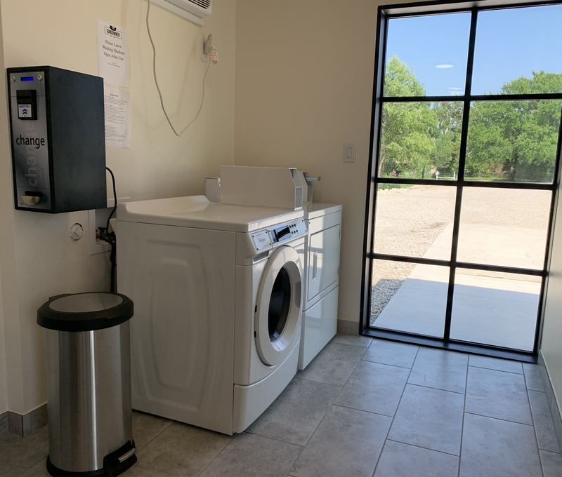 Clean Sundowner laundry room with washer and dryer